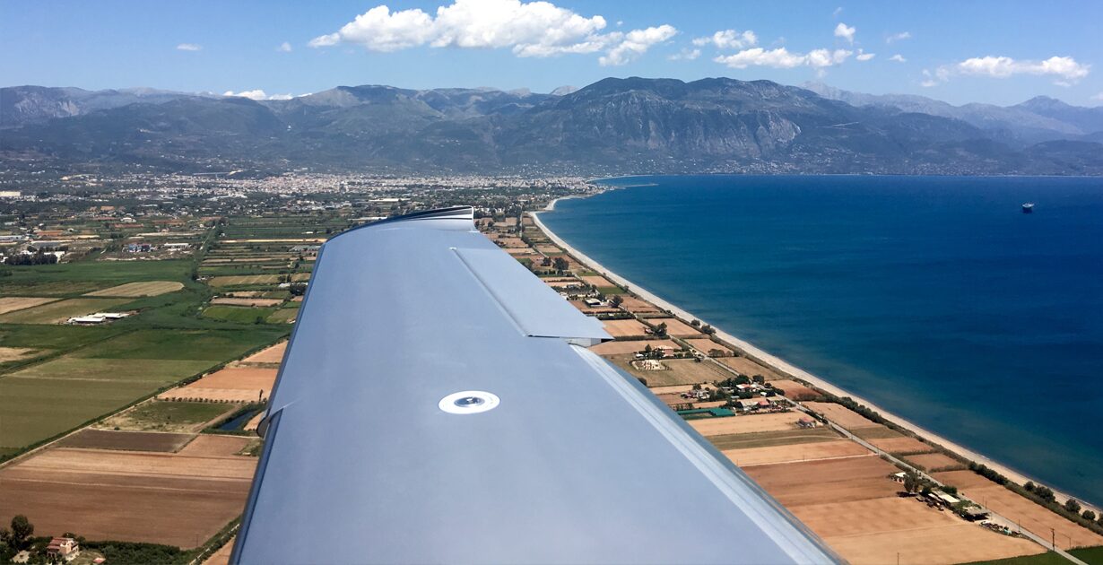Aerial view of Kalamata coastline taken from an airplane window during descent