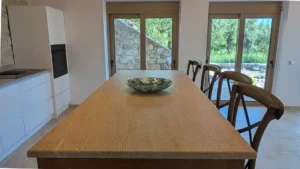 Kitchen at Achilles Cottage Kardamyli with stone island and bar seating