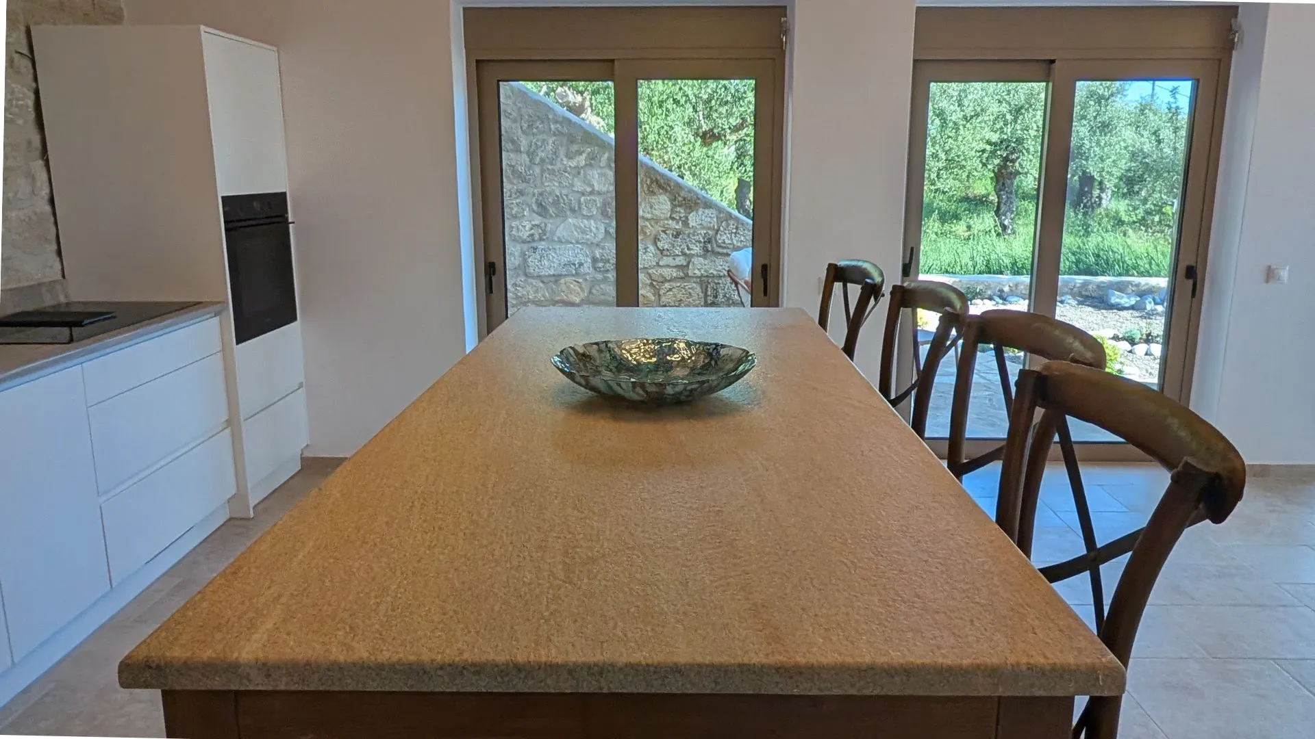 Achilles Cottage kitchen with stone island and bar seating