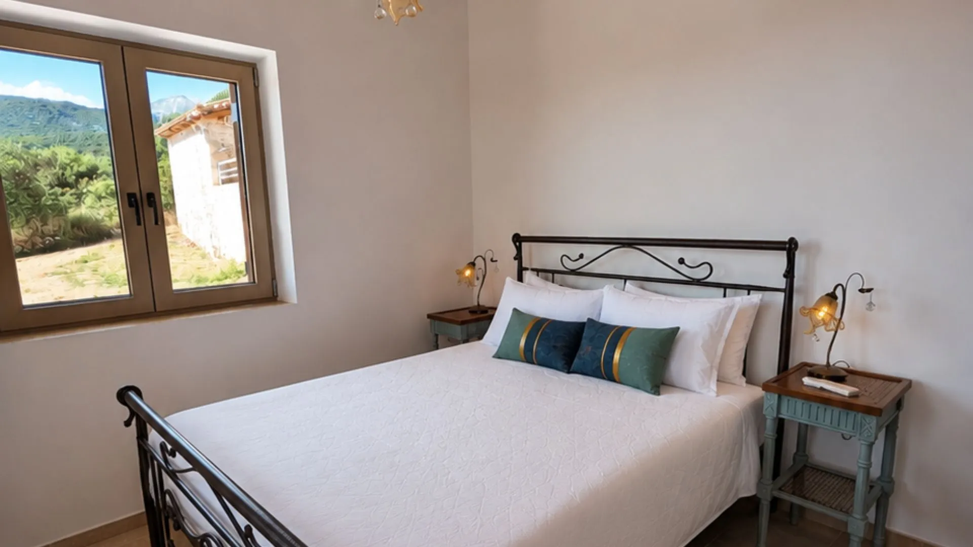 Achilles Cottage bedroom with Taygetos mountain view window in Kardamyli