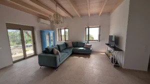 Achilles Cottage living room and garden doors in Kardamyli