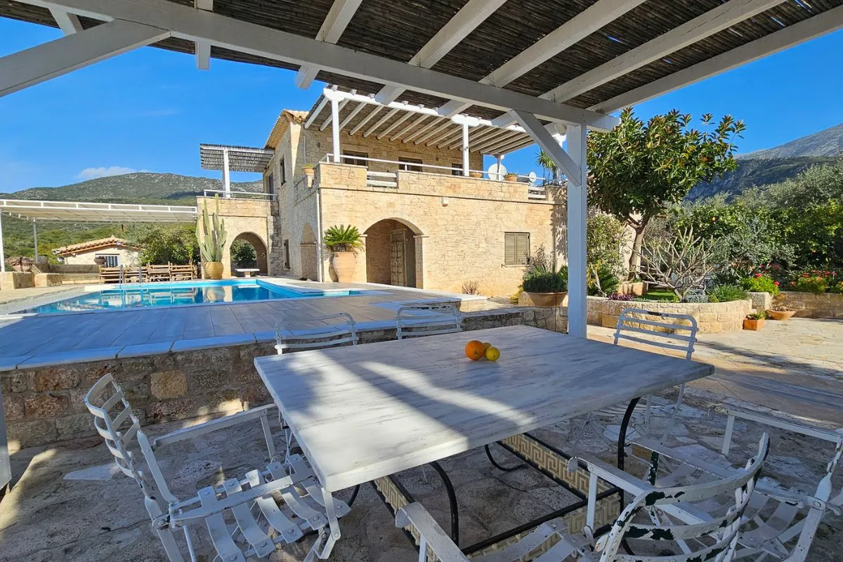 Main Villa covered outdoor dining by the pool in Kardamyli
