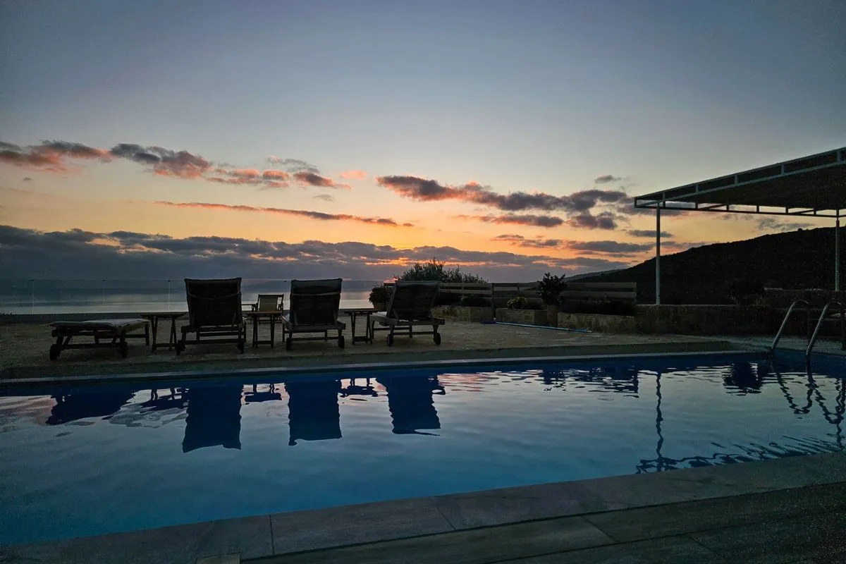 Main Villa infinity pool sunset view at Villa Leonidas in Kardamyli Greece