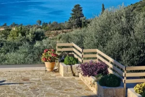 Stone terrace and Mediterranean garden at Villa Leonidas in Kardamili